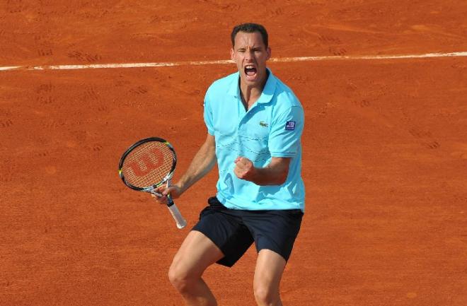 Marquer sa motivation sur le court. Un exemple de bonne attitude à avoir comme ici Michaël Llodra - © Icon Sport